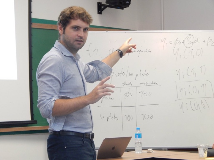 Florian Foos teaching at a whiteboard